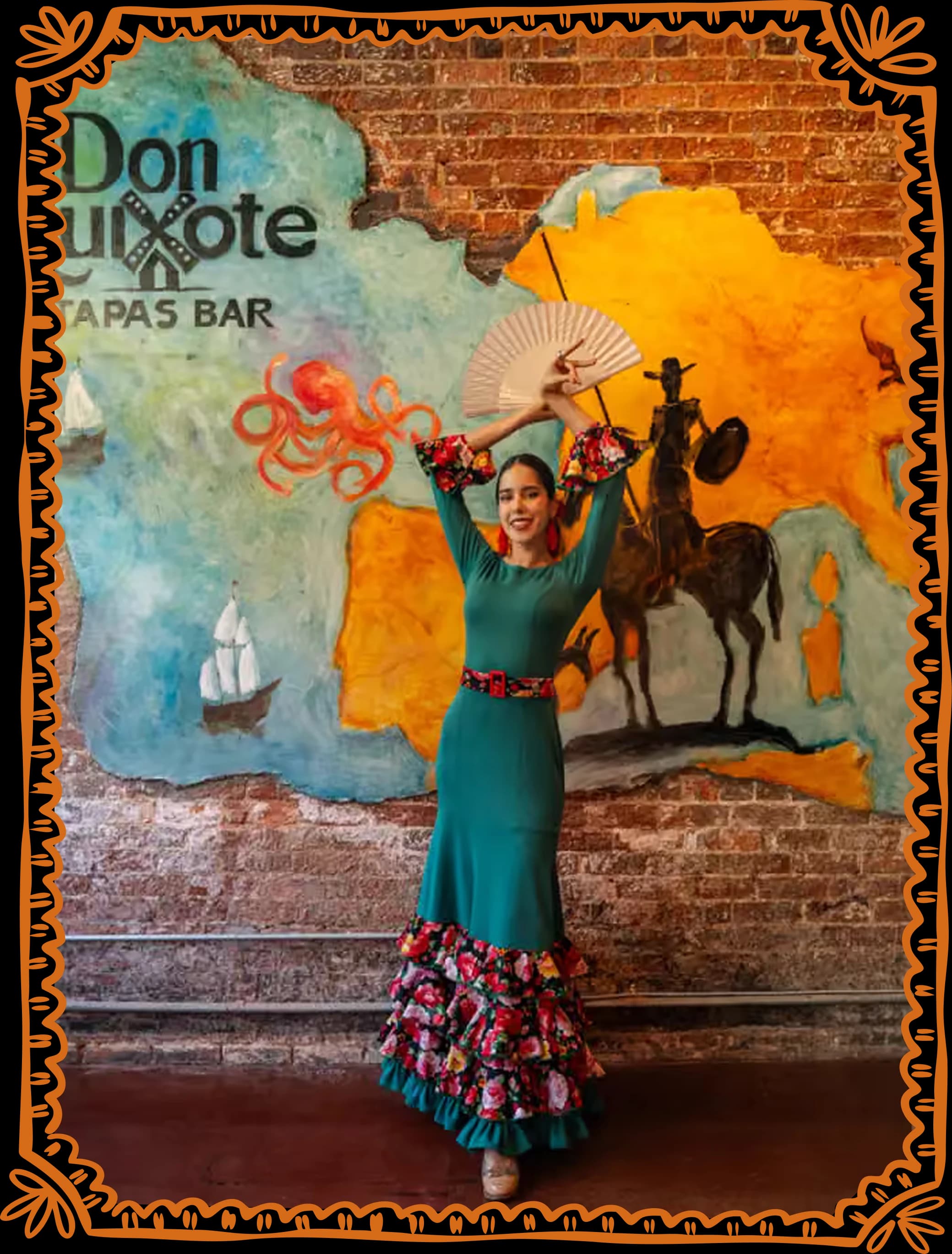 A flamenco dancer in a green dress, fan raised over her head, before the painted mural of the knight on horseback and the restaurant sign.